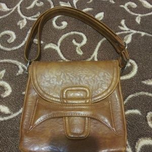 Woman's light brown handbag